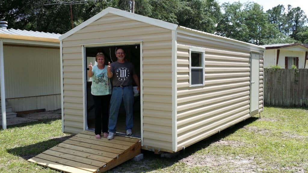 Happy shed delivery customers with a smile on their face