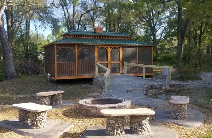 Fully installed screened backyard gazebo in Florida, offering a serene outdoor escape.