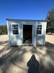 Cute storage shed, a small shed for tools and hobbies, adding charm to any backyard.