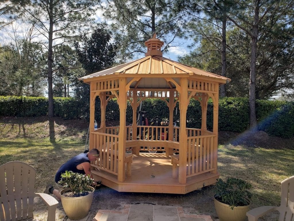 Installed wooden backyard gazebo, adding charm and functionality to outdoor spaces.