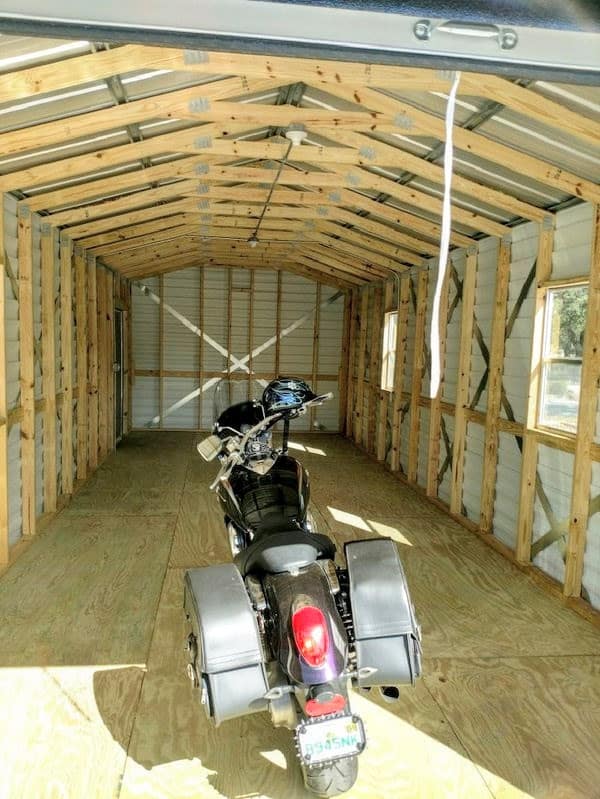 Wooden motorcycle storage shed - secure your bike with our durable sheds.