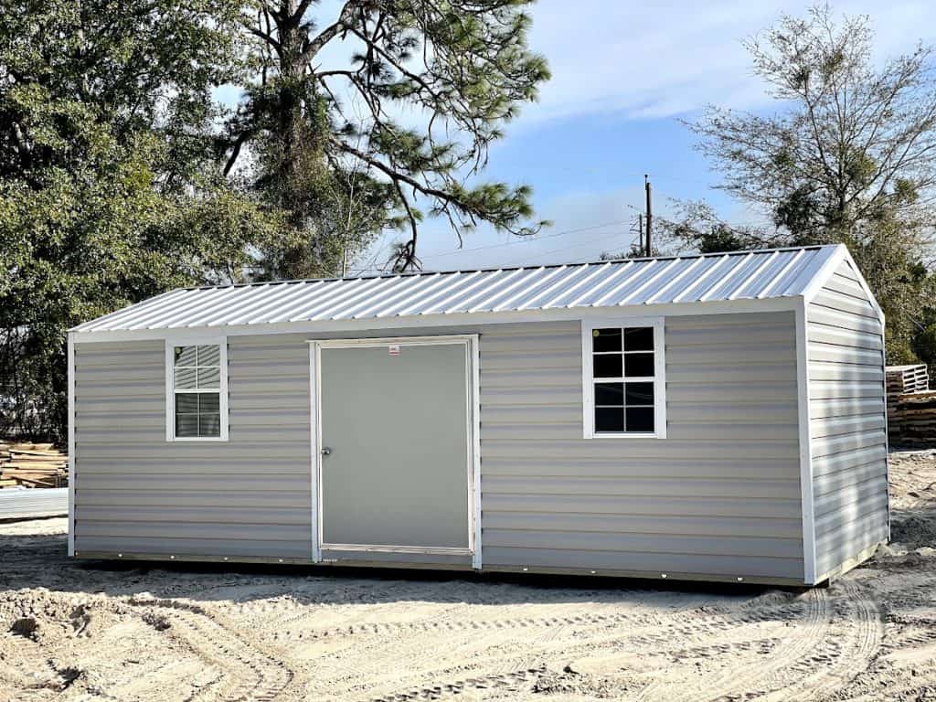 Outdoor tool shed with metal siding and wooden framing