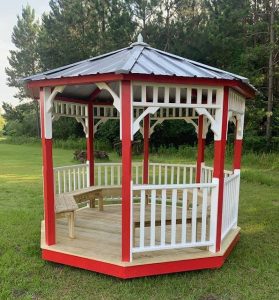 Red and white circle gazebo outdoor seating area covered with wooden roof in Florida, available for sale.