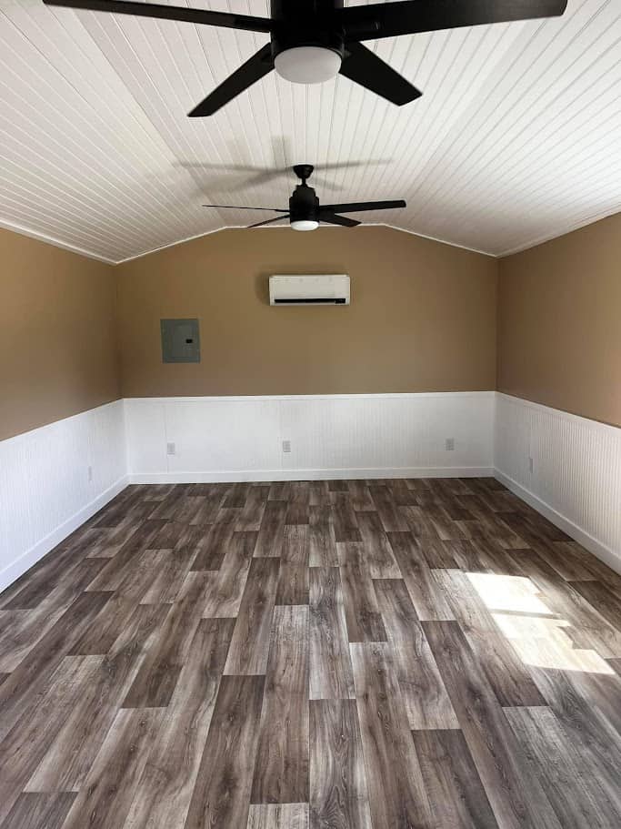 A finished Robin shed converted into a tiny house office, featuring a cozy and functional workspace.