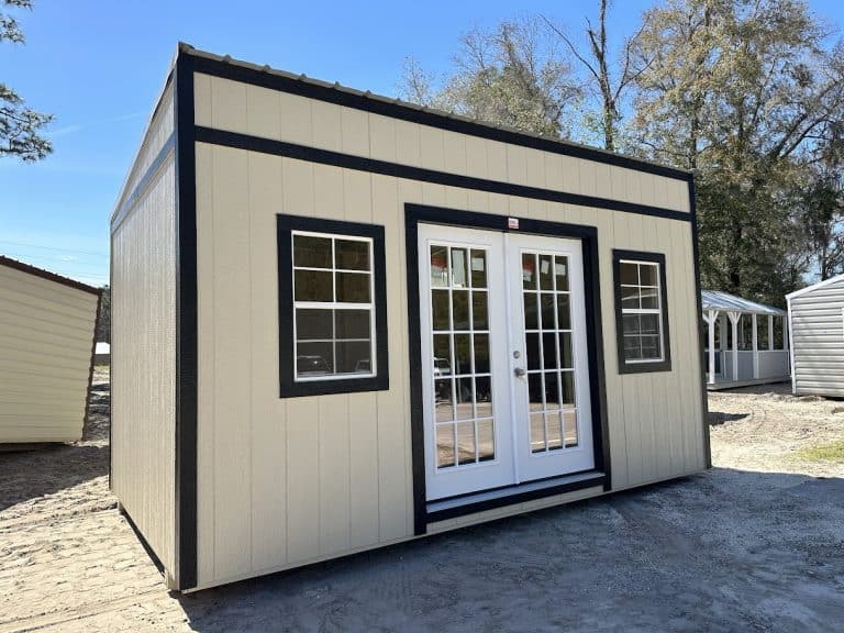 A single-slope tiny home with French doors, featuring a modern design and large windows.