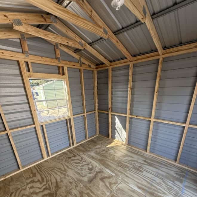 Interior of 10x10 Americana Steel Shed with wood stud framing, pressure treated plywood flooring, and pre-wired electrical package