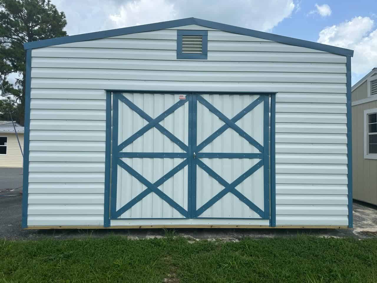 10x16 White Floridian Steel Shed with double doors, Hawaiian Blue trim, and Galvalume roof