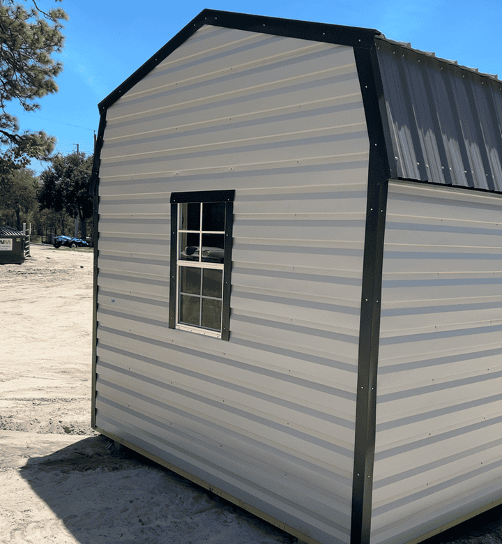 Rear view of 10x16 Ash Gray Steel Gambrel Cabin with Charcoal roof and Black trim