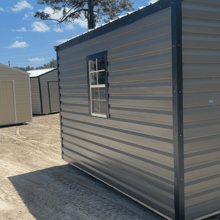 Side view of 12x12 Charcoal Steel Americana Shed showing Black trim, Galvalume metal roof, and colonial windows