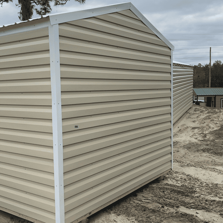 Rear of 10x12 Light Stone Americana Steel Shed with wood stud framing, pressure treated plywood flooring, and pre-wired electrical package