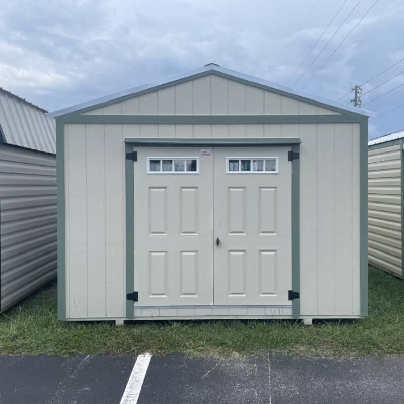 Front view of 12x16 Light Stone Americana Smartside Shed with Moss Green trim and double fiberglass doors featuring transom windows